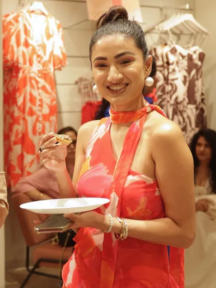 A happy guest enjoying one of my handcrafted bites at the Forever New launch party. My menus are designed to delight the senses and add a touch of culinary excellence to any special occasion.