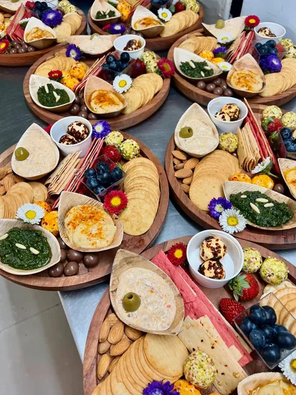 A collection of our individual cheese and dips platters, prepared for a corporate event. Each platter is a perfect single-serving graze, beautifully arranged with a variety of textures and flavours.