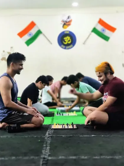Training the mind is as important as training the body. Our students engage in a game of chess after a tough physical workout to sharpen their strategic thinking.