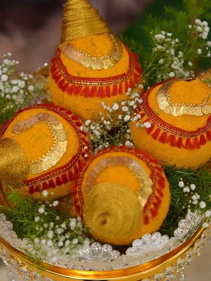 Decorating coconuts is a traditional art. I use turmeric, intricate threadwork, and gold details to make them auspicious and beautiful for any pooja or ceremony.