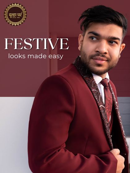 Festive looks made easy. A model in a deep maroon three-piece suit with an embellished lapel, perfect for a winter wedding reception.