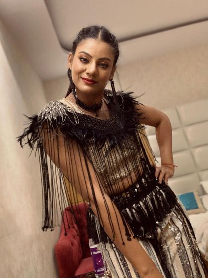 A close-up of my performance look for a New Year 2024 event. The combination of a fringed top and sparkling pants is perfect for a high-energy Bollywood or fusion dance number.
