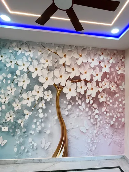 This finished room shows our popular 3D cherry blossom tree wallpaper. The design, combined with blue cove lighting in the false ceiling, creates a magical and serene ambiance perfect for a bedroom.