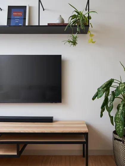 This simple yet elegant TV console in the Zen House is crafted from ash wood with a black steel frame. It reflects my minimalist approach, where every piece is designed with clean lines and a focus on material honesty.