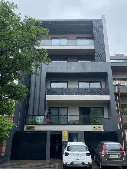 The completed building in Delhi, based on the 3D render in image 29. This photo shows the final structure with its distinctive facade lighting and metal screen details, confirming the accuracy of our design-to-build process.