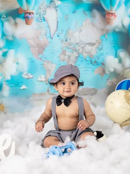 Before the smash, we take some clean portraits. This little traveler is ready for his first birthday adventure in our hot air balloon setup.