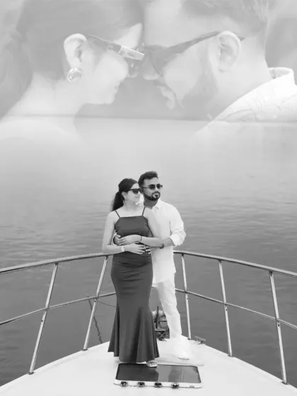 A black and white photo of the couple on a yacht, with a dreamy double exposure effect. This creates a timeless and artistic memory of their Goa pre-wedding shoot.