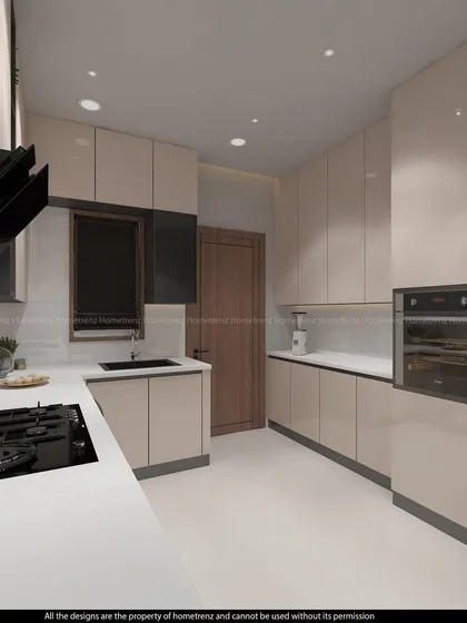 Another angle of the kitchen, showing the efficient L-shaped layout and the ample storage space.