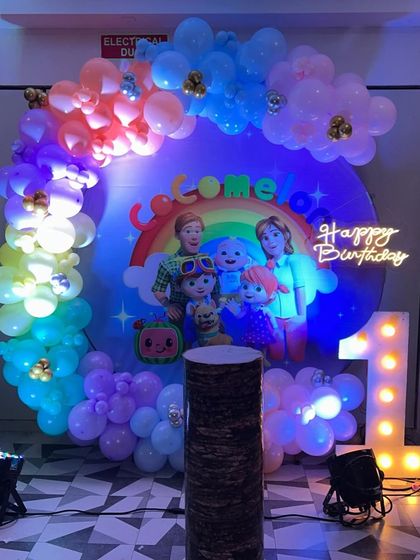 Cocomelon is a favorite for first birthdays! For Reeva's party, I designed a vibrant setup with a rainbow and character backdrop, a colorful balloon arch, and a light-up number '1'. The neon 'Happy Birthday' sign added a bright, modern touch to the celebration.