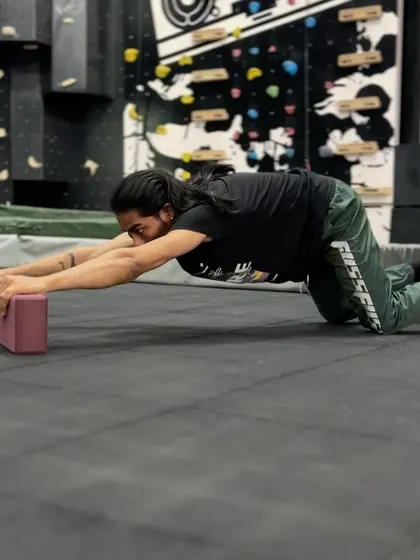 A demonstration of a child's pose single-arm extension, another great drill for thoracic mobility. These exercises help undo the effects of sitting at a desk all day.