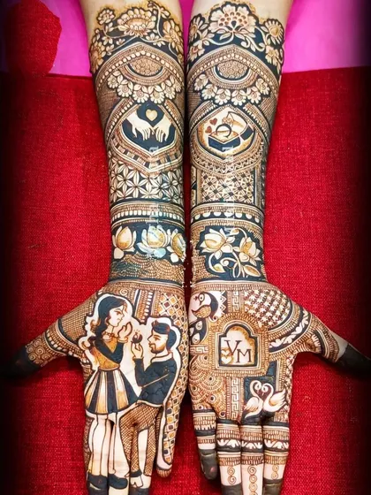 This engagement mehandi features a portrait of the couple during the ring ceremony. I love adding personal touches like this, along with initials and symbols like swans that represent their bond.