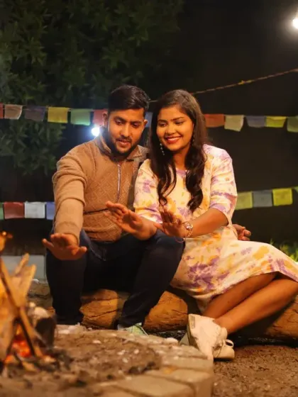 Create a cozy and intimate atmosphere with our unique campfire setup, perfect for a relaxed pre-wedding or couple's shoot. This outdoor setting, complete with a real fire and rustic props like an acoustic guitar, is ideal for capturing warm, natural moments.