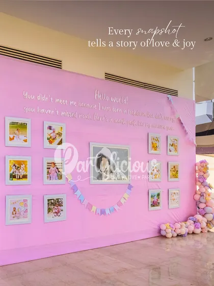 A personalized memory wall with a heartfelt quote, showcasing beautiful moments from the baby's first year.