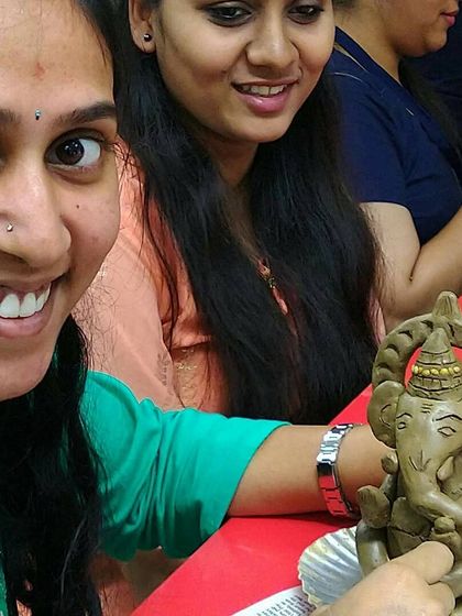 A participant proudly displays her handcrafted Ganesha idol. These themed workshops are a great way to celebrate festivals and traditions in a uniquely creative way.