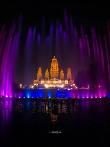 The spectacular musical fountain show at JK Temple in Kanpur. This long-exposure shot captures the vibrant colors of the fountains against the beautifully lit temple.