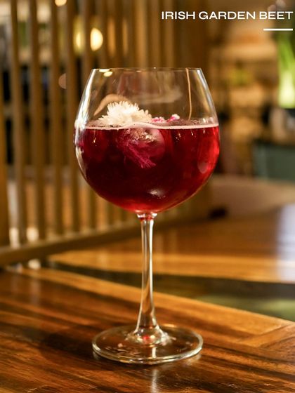 The Irish Garden Beet, a vibrant and earthy cocktail. This drink combines the smoothness of Irish whiskey with the natural sweetness of beetroot for a stunning result.