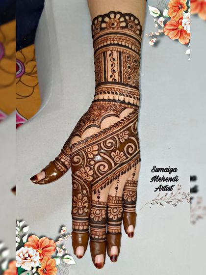 A beautiful semi bridal or party henna design with a floral band and swirling patterns on the palm.