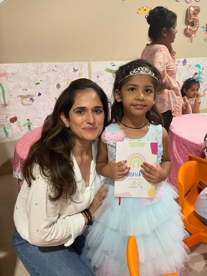 A princess for a day! This birthday girl, complete with a tiara, is so happy to be celebrating with a fun and creative art party.
