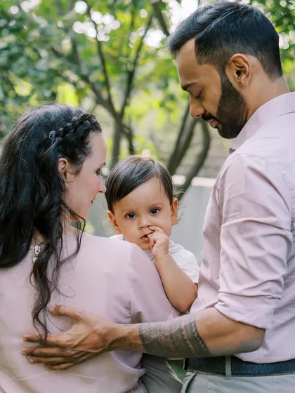 A family portrait showing the sweet, curious gaze of their one-year-old son.
