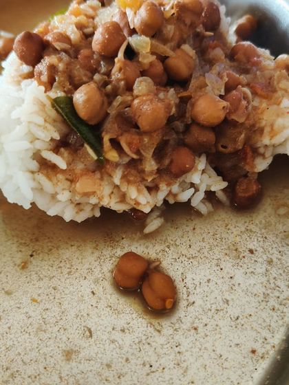 A client's meal of chana masala with rice. A classic and comforting dish that is also packed with protein and fiber.