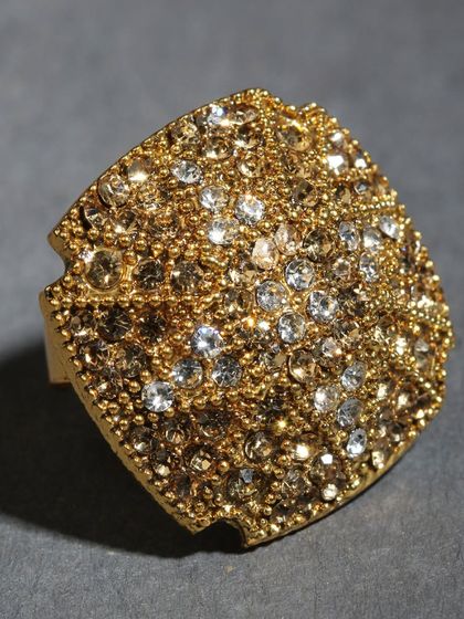 A square-shaped adjustable ring, fully studded with sparkling stones for a glamorous look.