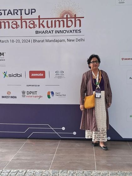 Standing before the Startup Mahakumbh wall at Bharat Mandapam. This event represents the spirit of innovation in India, and I was proud to represent the handcraft sector.