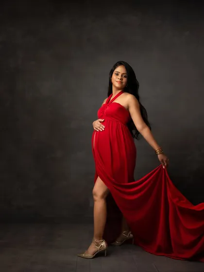 Stepping forward with grace. This pose in a flowing red gown captures movement and the feeling of moving into a new chapter.
