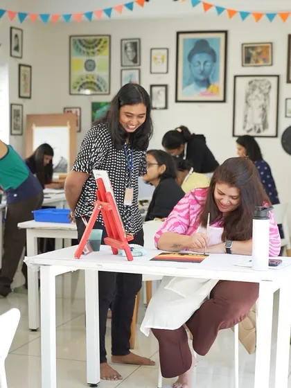 Personal attention is key to learning. Here, one of our instructors provides one on one guidance during a painting session. We keep our class sizes small to ensure every student gets the support they need to develop their skills and confidence.