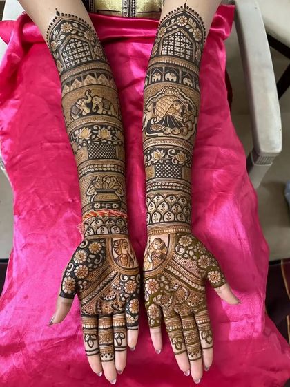 A traditional design featuring elephants, a doli scene, and a kalash, all symbols of an auspicious wedding.