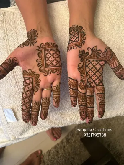 A modern take on guest mehndi with geometric blocks and floral accents.