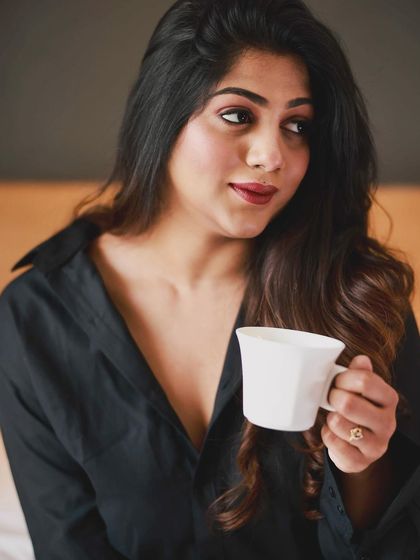 This image shows how the makeup and hairstyle look from a different angle. The soft curls have a beautiful, natural-looking texture and shine.