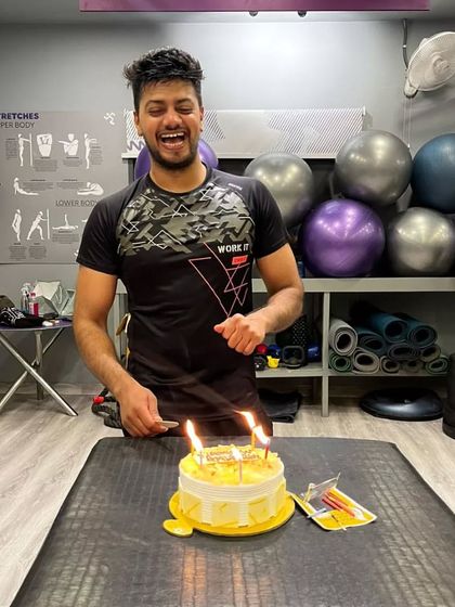 Celebrating our Bhangra king, instructor Ankit Rajawat, on his birthday. He's all smiles with his cake, surrounded by the gym family.