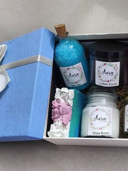 This beautiful blue gift box is filled with a fantastic combination of my bath and body products. It includes bath salt, coffee scrub, body wash, shea butter, mud mask, and a decorative soap.