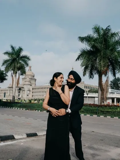 A classic couple portrait with the grand architecture of Vidhana Soudha providing a timeless and elegant backdrop. This is a popular choice for pre-wedding photography in Bangalore.