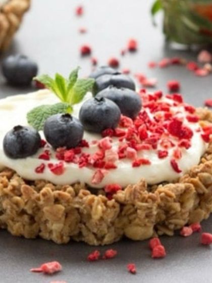 A healthy and elegant dessert option. These granola tartlets are filled with yogurt and topped with fresh blueberries and freeze-dried raspberries for a pop of color and flavor.