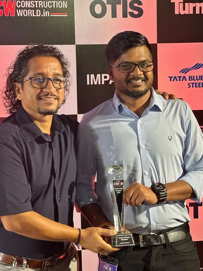 I am deeply honored to receive awards for my work, as they recognize the dedication of my entire team and the trust of my clients. Here, my colleague and I are accepting the Construction World Architect and Builder (CWAB) Award for "House of Greens."