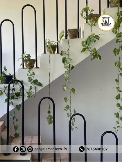 A unique and artistic staircase railing featuring curved, U-shaped metal balusters. This creative design adds a soft, organic feel to the interior space, turning a safety feature into a decorative highlight.