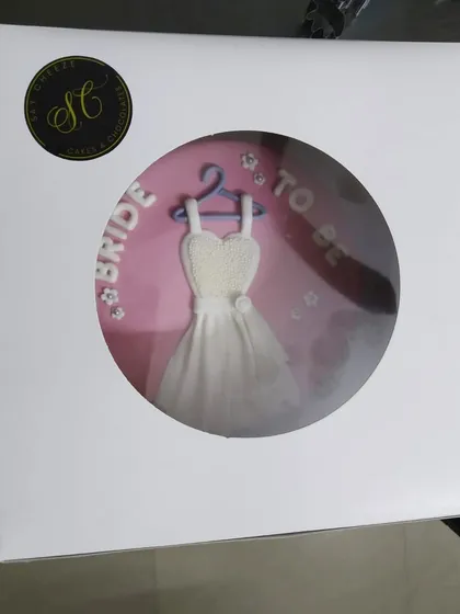 The "Bride to Be" cake, beautifully packaged and ready for delivery. The window box gives a perfect preview of the adorable and detailed design inside, making it a wonderful gift for the future bride.