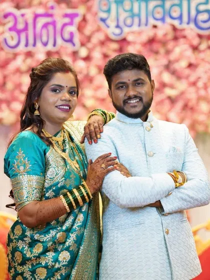 A classic pose for the newlyweds. The bride's reception look was both traditional and glamorous.