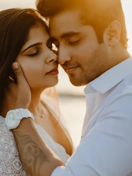 In the warm embrace of the golden hour, a moment of pure, quiet connection. This intimate close-up captures the gentle touch and serene love that I strive to find in every pre-wedding beach shoot.