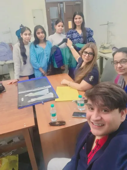 In a portfolio review session with fashion students. A strong portfolio is your entry ticket to the industry. I guide students on how to curate their best work to tell a compelling story about their skills and design philosophy.