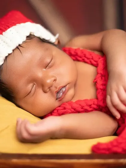 A close-up of the baby in the Santa hat. I love capturing these detailed shots that highlight how tiny and precious they are.