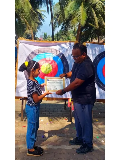 This young girl receives her certificate after showing great enthusiasm throughout the March 2023 course.