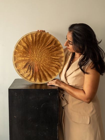 Admiring the intricate details of "The Golden Flower." It stands as a symbol of reinvention and resilience, a reminder that beauty is endless when we choose to recreate.