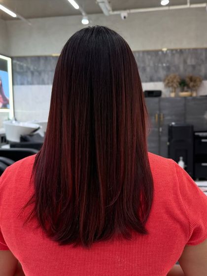 The final result of a beautiful red hair transformation. The color is rich and vibrant, and the hair looks incredibly healthy and shiny.