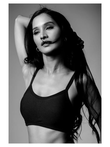 Another powerful black and white image from the same activewear shoot, this time with a focus on movement and energy.