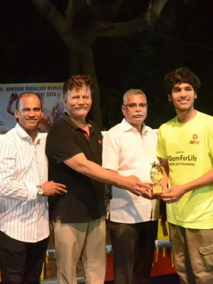 One of our youth boxers receiving the Best Boxer award. We focus on developing skill and sportsmanship from an early age.