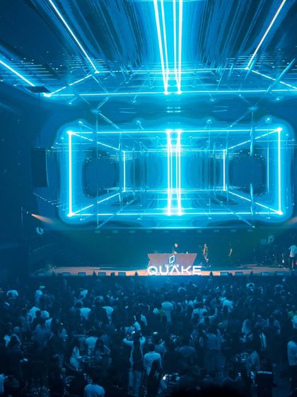 The incredible blue-lit, cube-like structure of the stage at Quake Arena. A truly world-class venue.