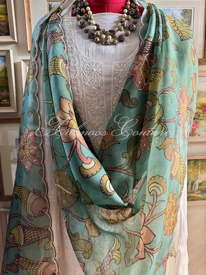 A draped view of the suit, showing the beautiful fall of the organza dupatta.