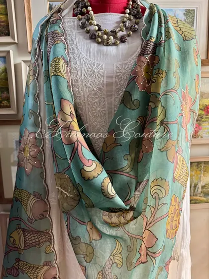 A draped view of the suit, showing the beautiful fall of the organza dupatta.